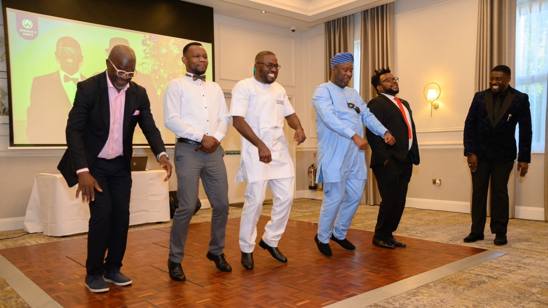 Fathers and sons dancing in harmony on the ballroom floor
